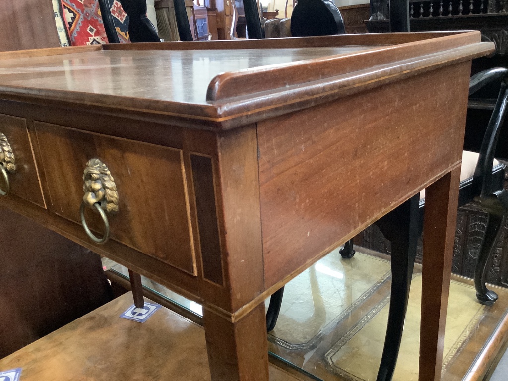 A George III mahogany side table, having three-quarter galleried top over three short drawers on tapered legs, width 95cm depth 51cm height 77cm